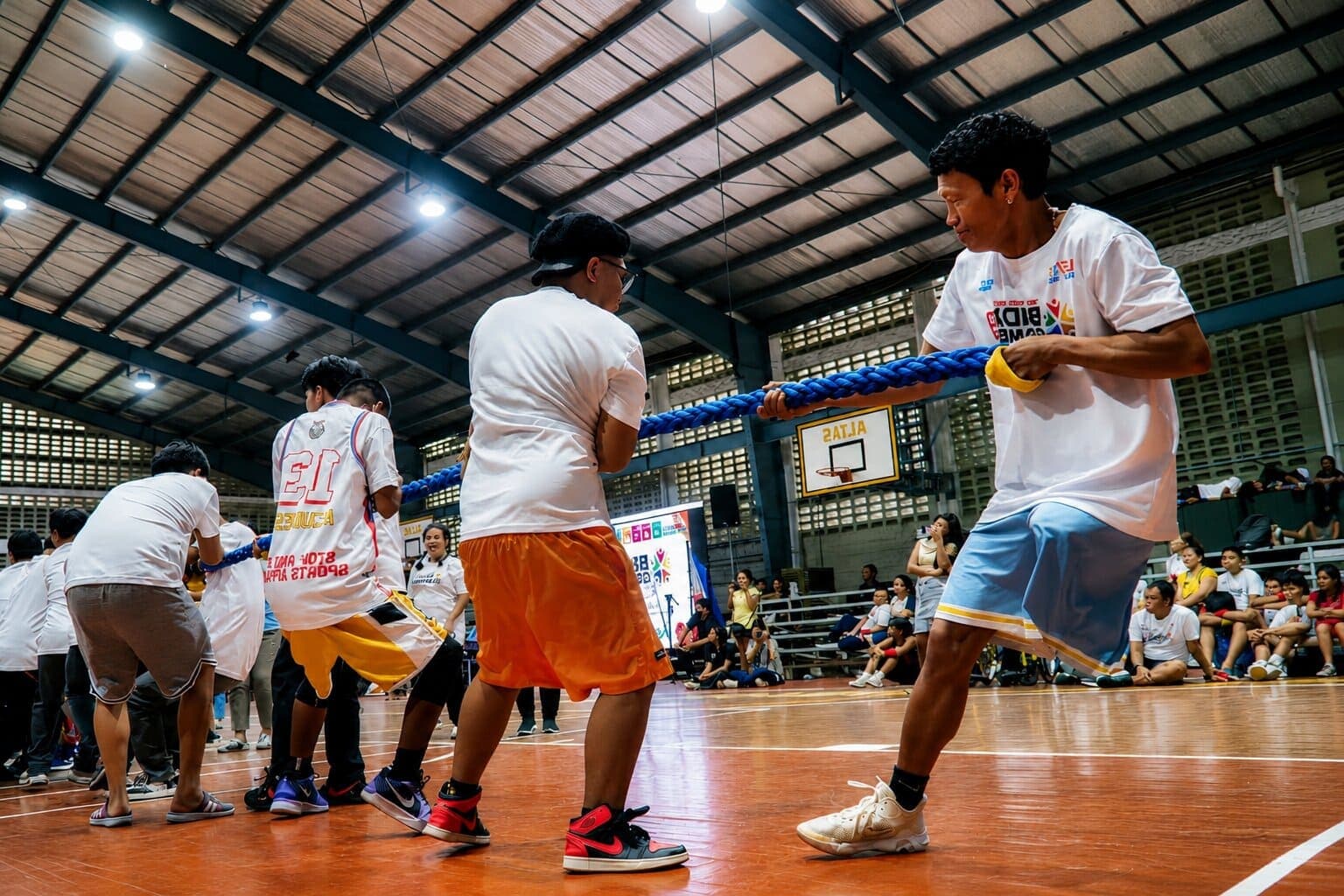 Participants and volunteers pull together in a tug-of-war challenge at BIDA Games 2026.